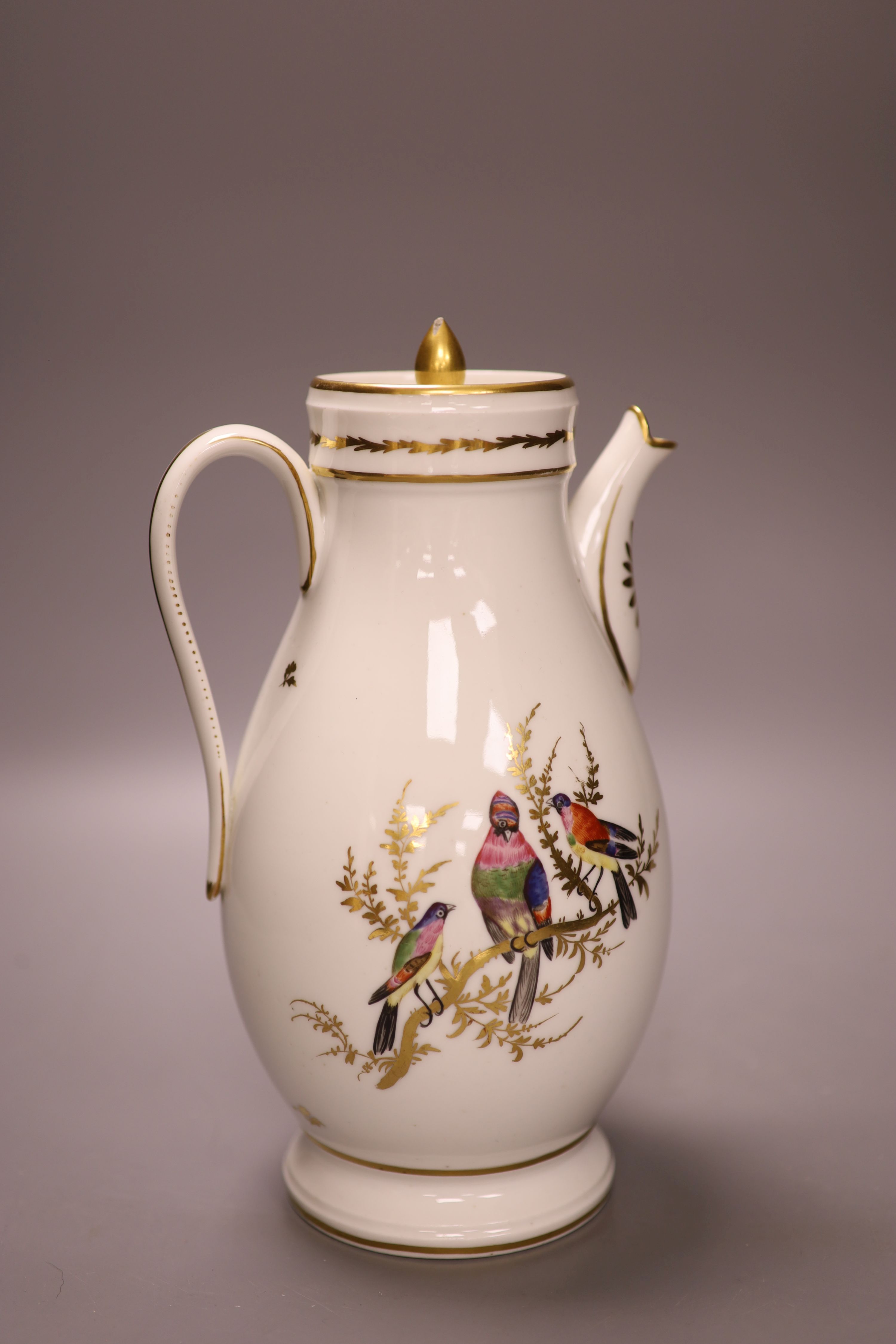 A French chocolate pot and cover finely painted with birds in gilded trees, incised mark, perhaps M, late 18th century, height 26cm